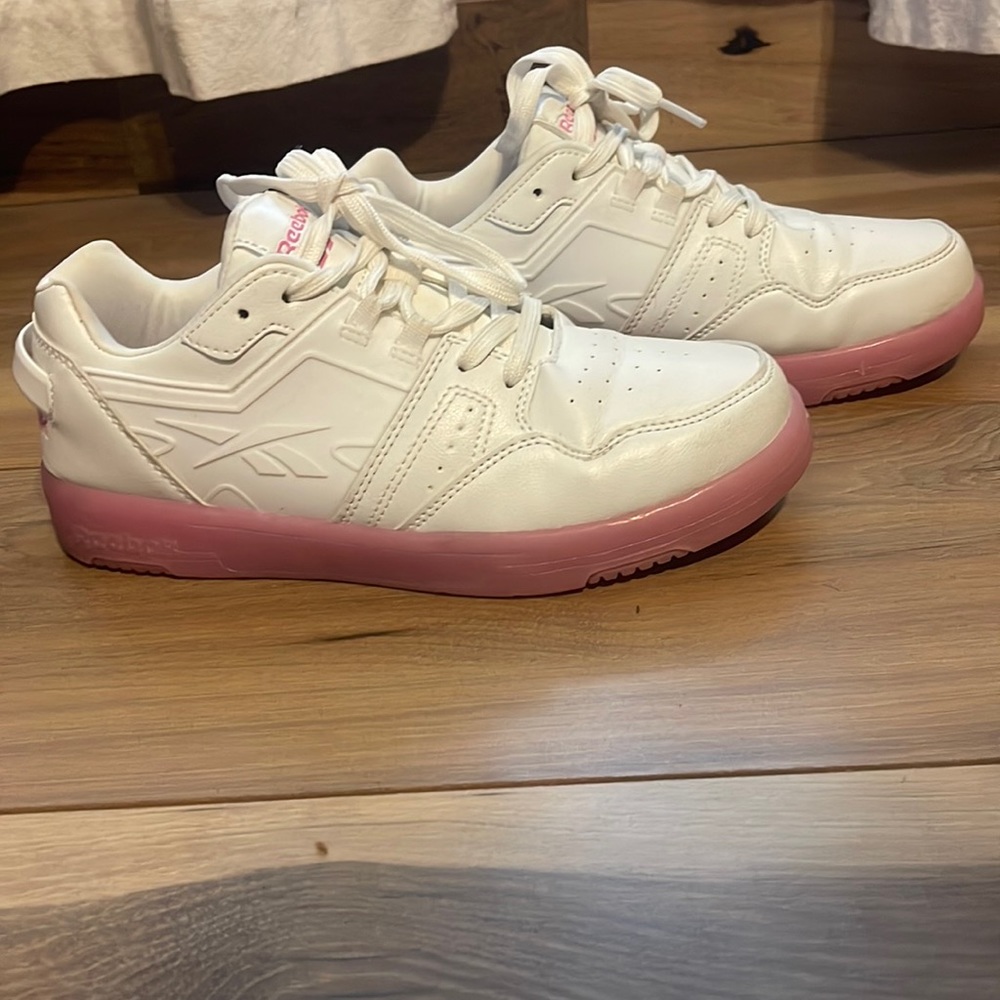 Leather white upper shoe and pink sole. Barely used.